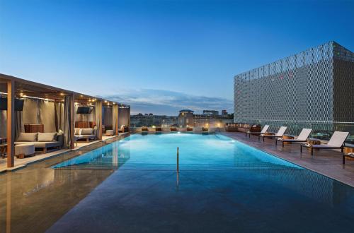 a swimming pool on the roof of a building at Thompson San Antonio - Riverwalk, by Hyatt in San Antonio