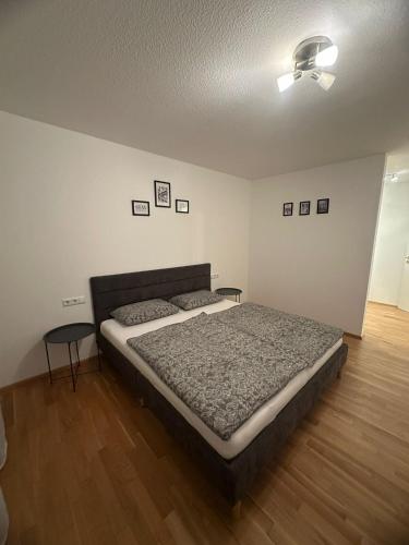 a bedroom with a bed and a ceiling fan at SeePERLE 131 in Friedrichshafen