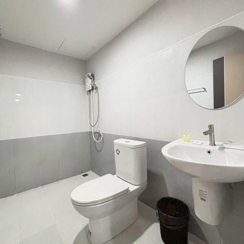 a white bathroom with a toilet and a sink at Ma Relax Place in Ban Hau Chang