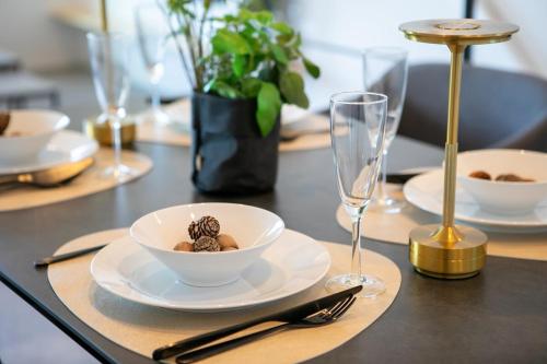 a table with plates and a bowl of food on it at Seven Saunas Village in Arao