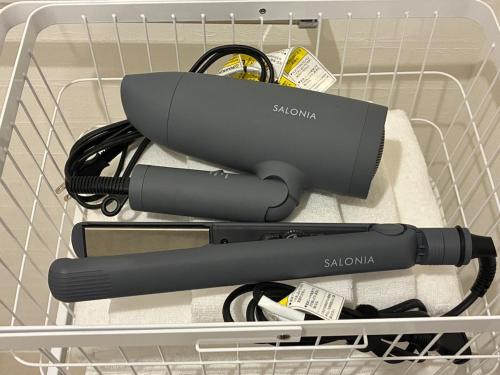 two hair dryers in a basket in a drawer at trive meieki nishi 101 最大6名宿泊可 名古屋駅まで1駅 太閤通駅徒歩4分 in Nagoya