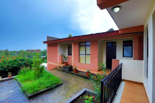 a house with a balcony with a view at Budget Gest House in Lalibela