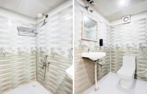 a bathroom with a sink and a toilet at RROOMS Eco Hotel Blue Stone- Near Singapore Mall And Max Hospital in Lucknow