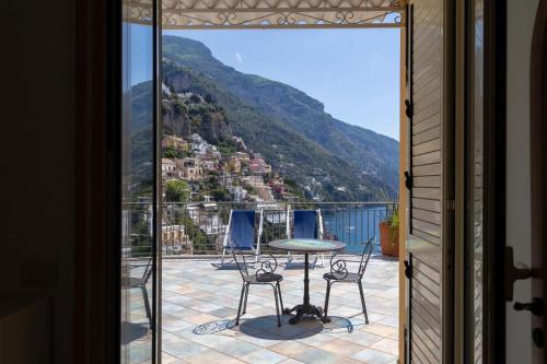 a view of a balcony with a table and chairs at Hotiday Positano Sea View in Positano