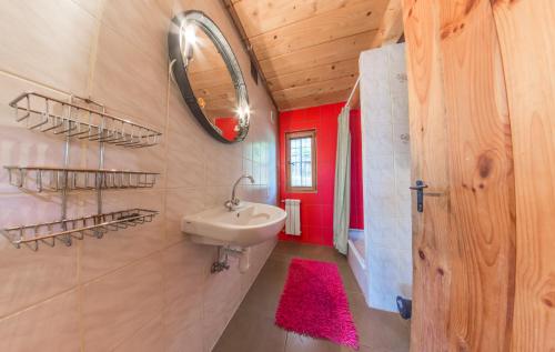 a bathroom with a sink and a mirror on the wall at Domki na Stoku in Ustrzyki Dolne