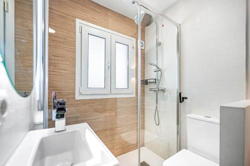 a bathroom with a sink and a shower at Merced luxury in Málaga