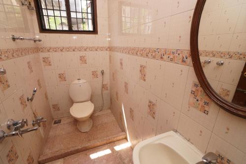 A bathroom at Lloyds Serviced Apartments,Krishna Street,T Nagar