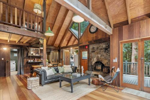 a living room with a couch and a fireplace at Rustic 3-Bed Retreat in Springbrook in Springbrook