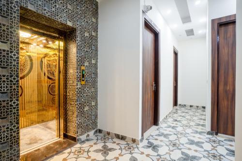 a bathroom with a shower with a glass door at Hotel Delhi 53 Near ISBT Kashmiri Gate in Delhi