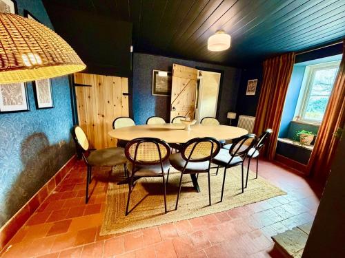 a dining room with a table and chairs at Style 3BR House Jameston | Garden | Near Tenby in Tenby