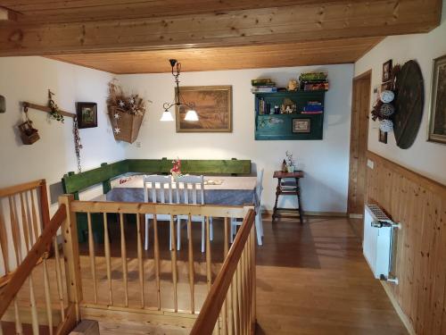 a room with a bed and a wooden floor at Familienferienhof Sell´s Scheune in Sundhausen