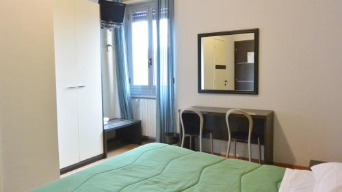 מיטה או מיטות בחדר ב-Hotel Arno