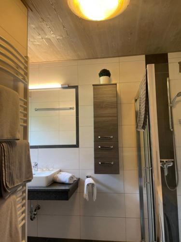 a bathroom with a sink and a mirror at Ferienhaus Julia in Admont