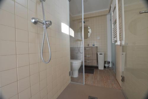 a bathroom with a shower and a toilet at Casota in Sintra