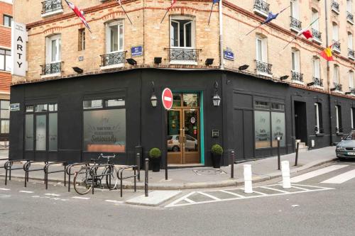 a black building with a bike parked in front of it at Arty Paris Porte de Versailles by River in Paris