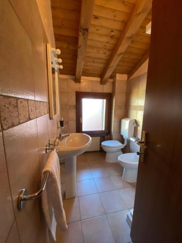 a bathroom with a sink and a toilet at Ca' Del Doge in Caorle