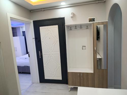 a room with a black and white door and a bed at BlueRoyal Home Sultanahmet in Istanbul