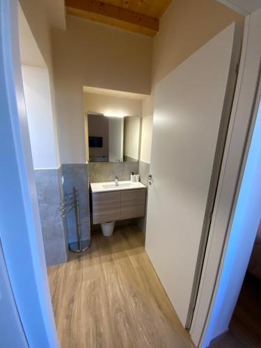a bathroom with a sink and a mirror at Casale La Rosa Azzurra in Ponte Buggianese