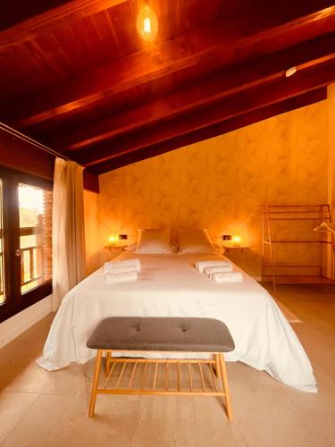a bedroom with a large bed in a room at Casa Kirana - Habitaciones in Bermeo
