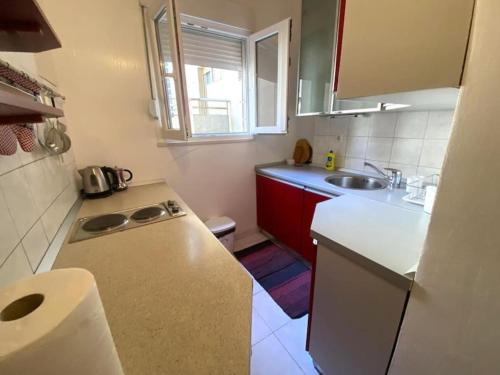 a small kitchen with a sink and a counter at Apartment Zagor Split in Split