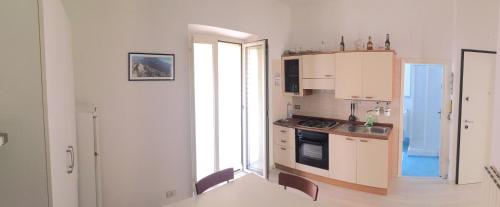 a kitchen with a sink and a stove top oven at Vacanze a Gaeta in Gaeta