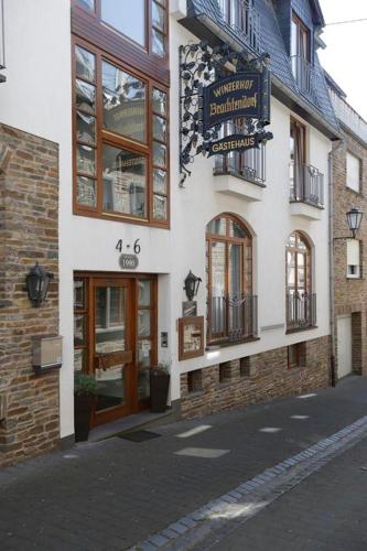 a building with a sign on the side of it at Winzerhof Brachtendorf in Alken