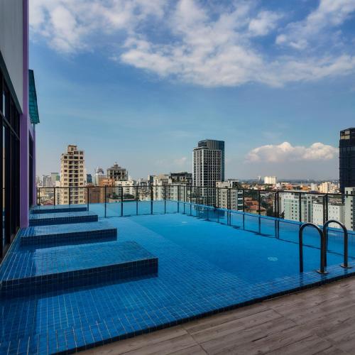 a large swimming pool on the roof of a building at Bolyno Skyline Hotel in Phnom Penh