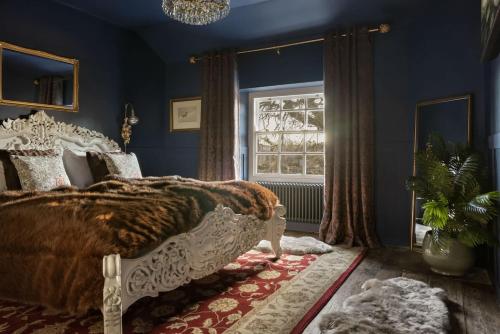 a bedroom with a bed and a window at Old Earth - Ridgestone in Kendal