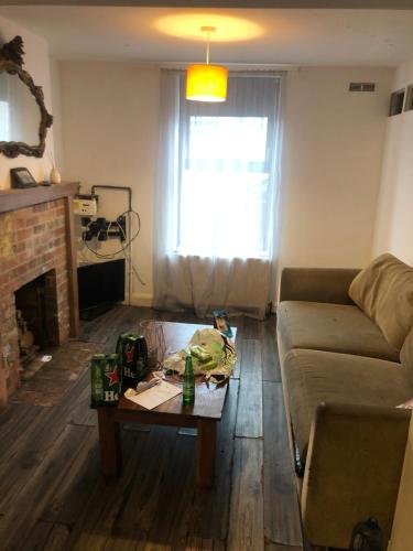 a living room with a couch and a coffee table at Soho Accommodation in Newry