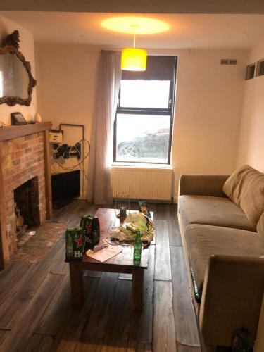 a living room with a couch and a coffee table at Soho Accommodation in Newry