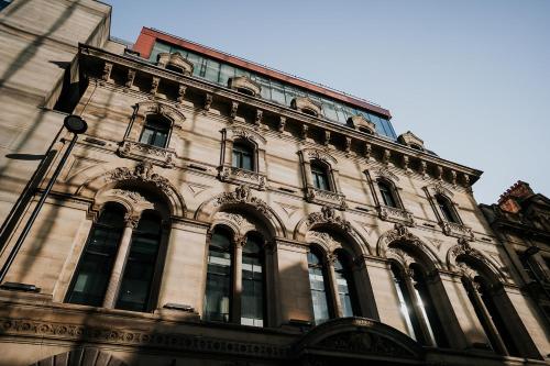 a tall building with many windows on the side of it at King Street Townhouse Hotel & Spa in Manchester