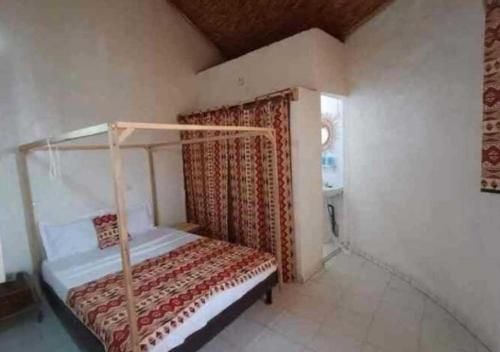 Postelja oz. postelje v sobi nastanitve Djembé B&B
