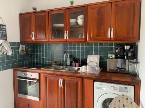 Virtuvė arba virtuvėlė apgyvendinimo įstaigoje MonLocal