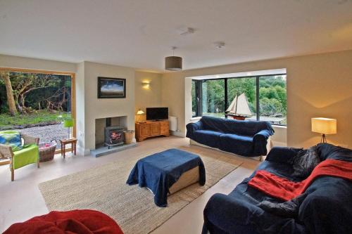a living room with two couches and a fireplace at 3 Bed in Sneem oc-i136 in Sneem