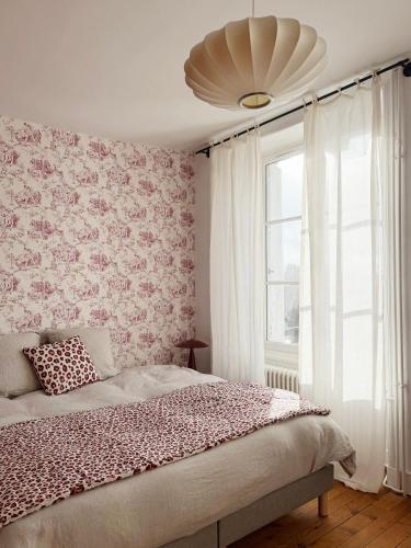 Postel nebo postele na pokoji v ubytování Maison Mansel