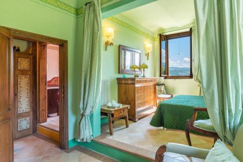 a bedroom with a bed and a window at Antica Filanda Sunshine in Arezzo