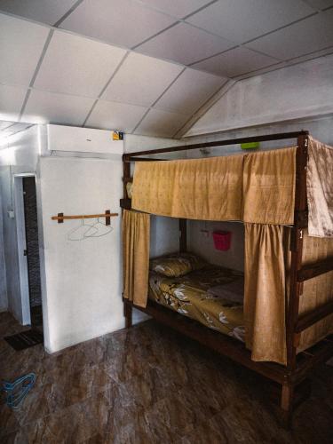 a room with a bunk bed in a room at Mukda in Ko Yao Noi