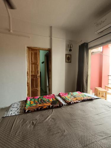 a bedroom with a bed in a room at Dapolihideaway in Dapoli