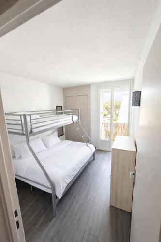 Llit o llits en una habitació de L'Escale Bleue