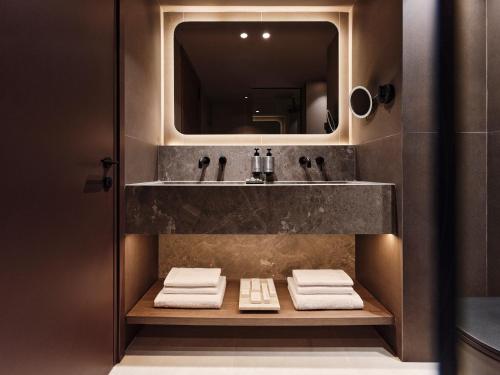 a bathroom with a sink and a mirror at The Fiction in Athens