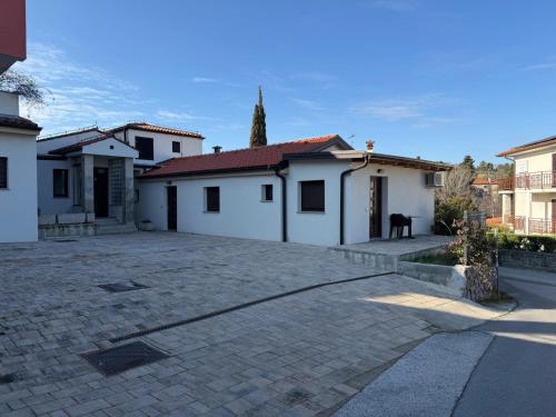a parking lot in front of some white buildings at APARTMENTS EDWINA in Portorož