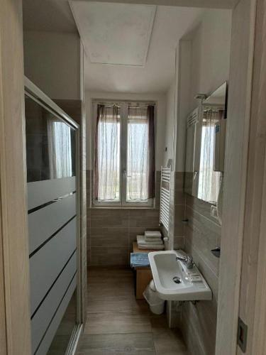 a bathroom with a sink and a toilet at Chalet del Sol in Fano