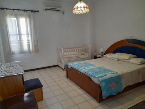 Llit o llits en una habitació de Diotima Rhodos Experience