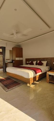 a bedroom with a large bed in a room at Rivero Resort in Dirang Dzong