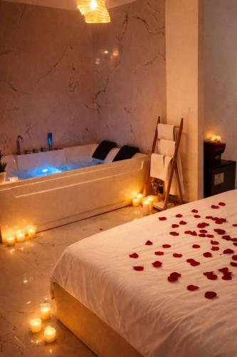 a bedroom with a tub and a bed with roses at Nuvola Luxury suite con Idromassaggio Privato & Relax romantico in Turin