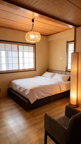 a bedroom with a large bed in a room at KOKI Hotel in Yokohama