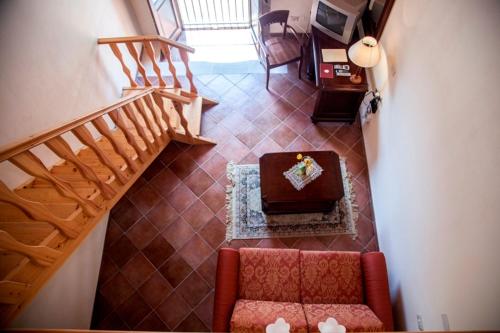 an overhead view of a living room with a chocolate cake at Feudo Bauly in Palazzolo Acreide