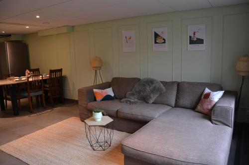 a living room with a couch and a table at Nature and tranquility in Soest with Forest, Dunes and City in Soest