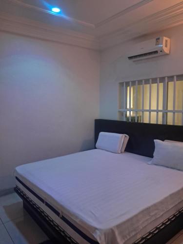 Llit o llits en una habitació de Beraca INN