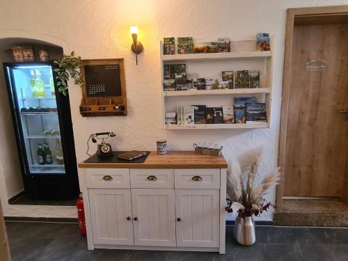 a kitchen with a counter and a refrigerator at Apartment Kraxler Pärchen by Interhome in Weißenstadt